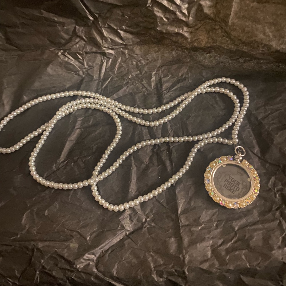 3 For $13
NolaAngel Designs long pearl necklace with picture pendant - Picture 2 of 3
